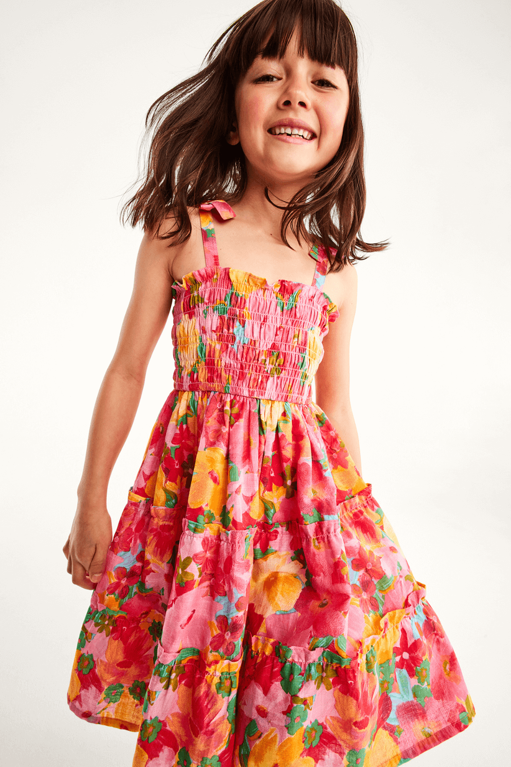 Child model in colourful party dress