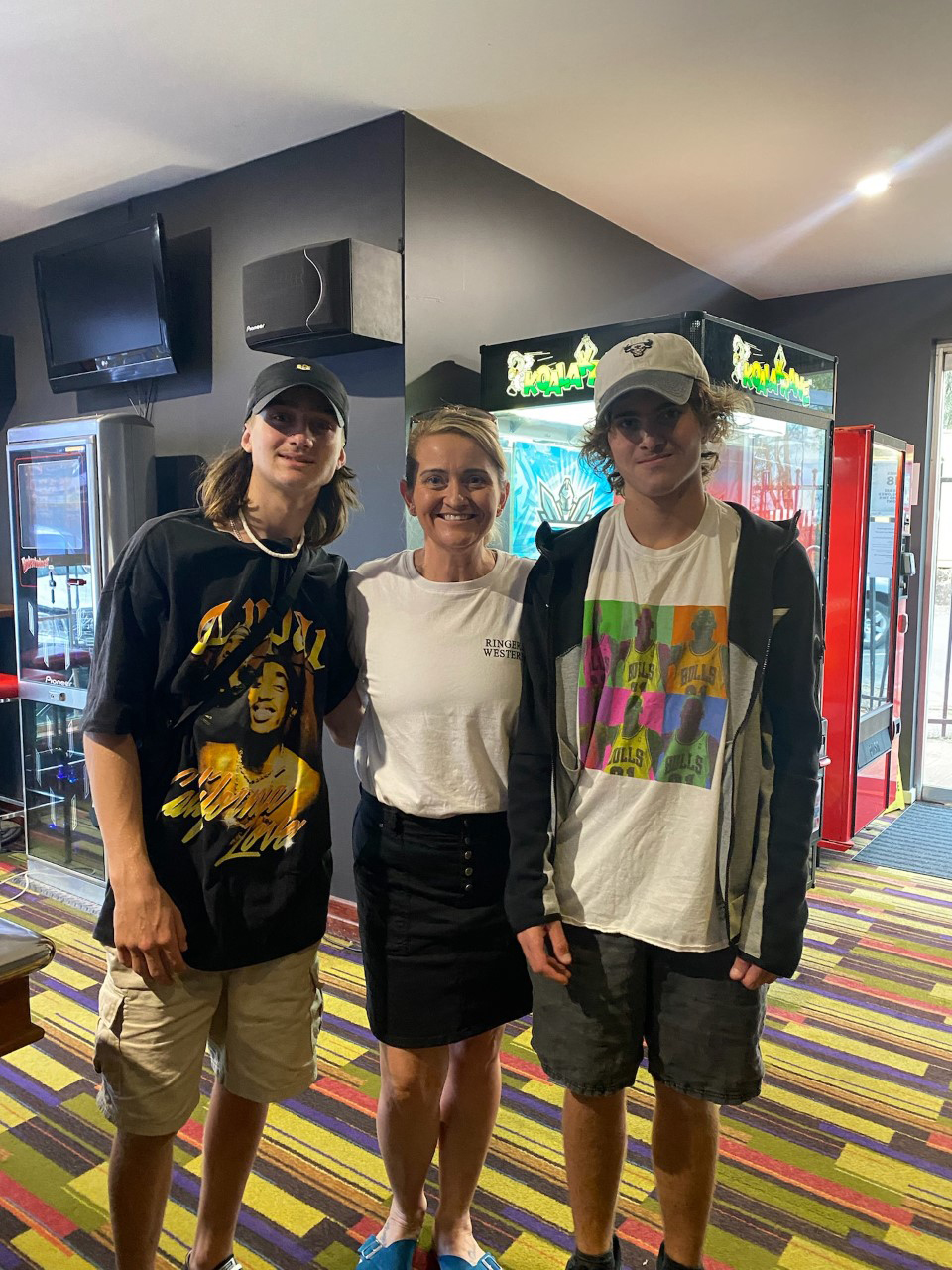 Mandi with her sons Angus, 16, and Oscar, 17 (right).