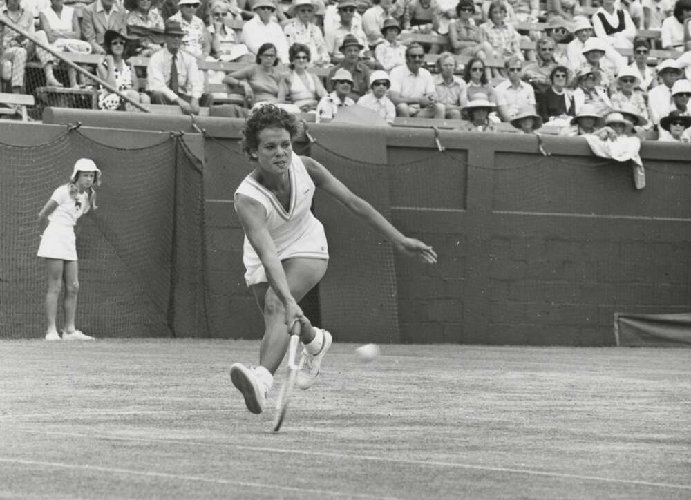 Evonne Goolagong Cawley playing tennis.