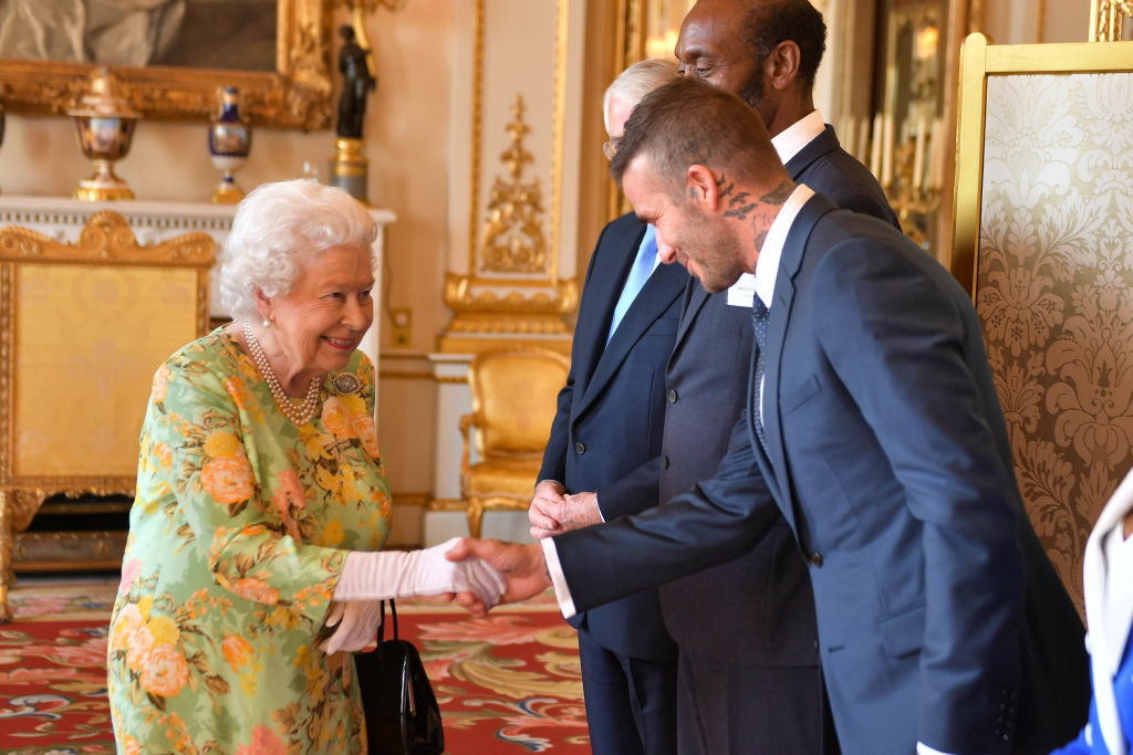 Queen Elizabeth II meets David Beckham at Buckingham Palace on June 26, 2018 in London