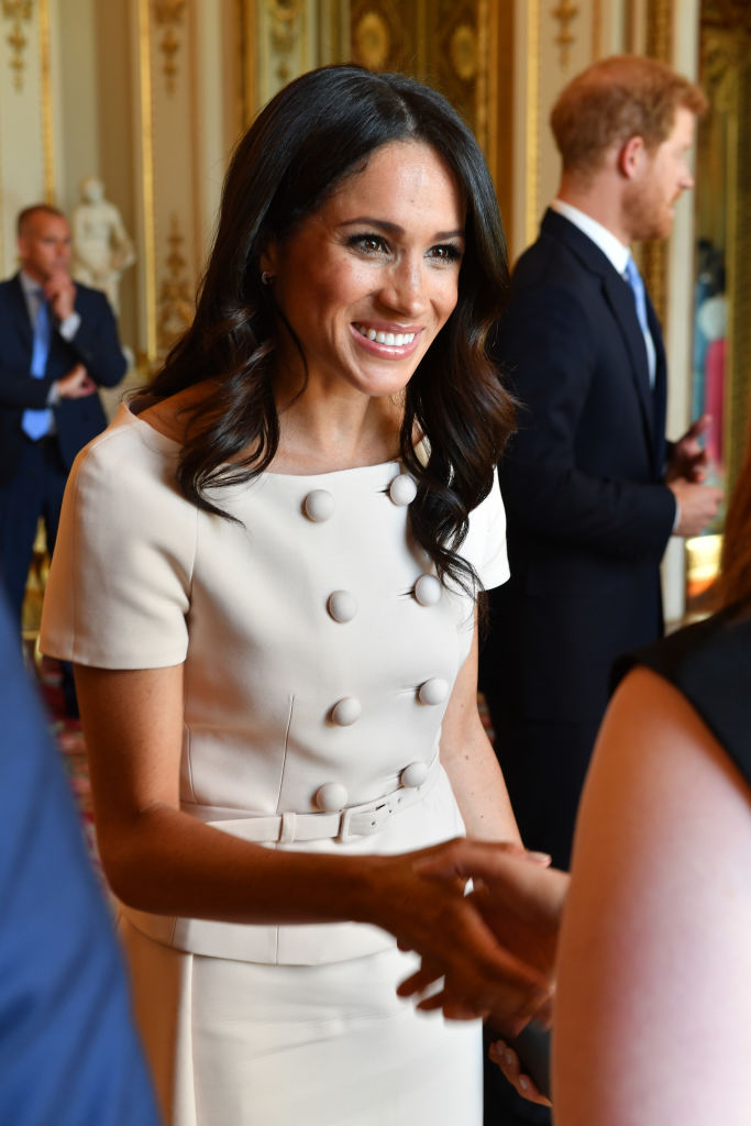Meghan, Duchess of Sussex meets guests at the Queen's Young Leaders Awards Ceremony at Buckingham Palace on June 26