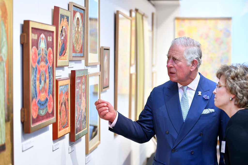 Prince Charles, Prince of Wales looks at art as he attends The Prince's Foundation School of Traditional Arts degree show in Shoreditch on June 27