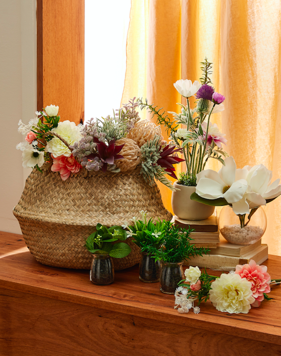 faux flowers and seagrass basket