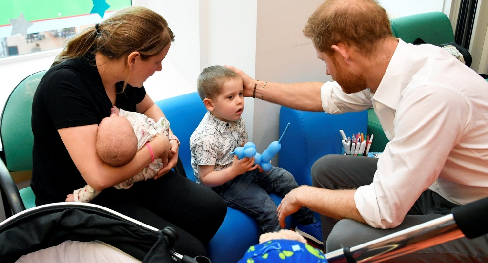 He also met parents during his visit to the Kamran Jabble ward (Toby Melville/PA)