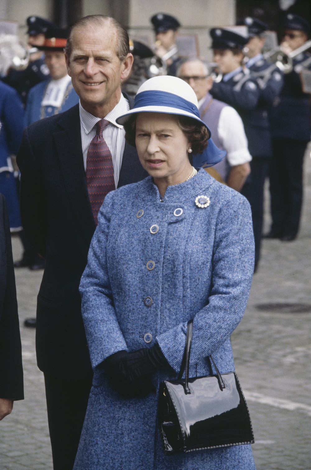 Queen Elizabeth with Prince Philip and her trusty Launer Royale bag in Zurich, Switzerland in 1980