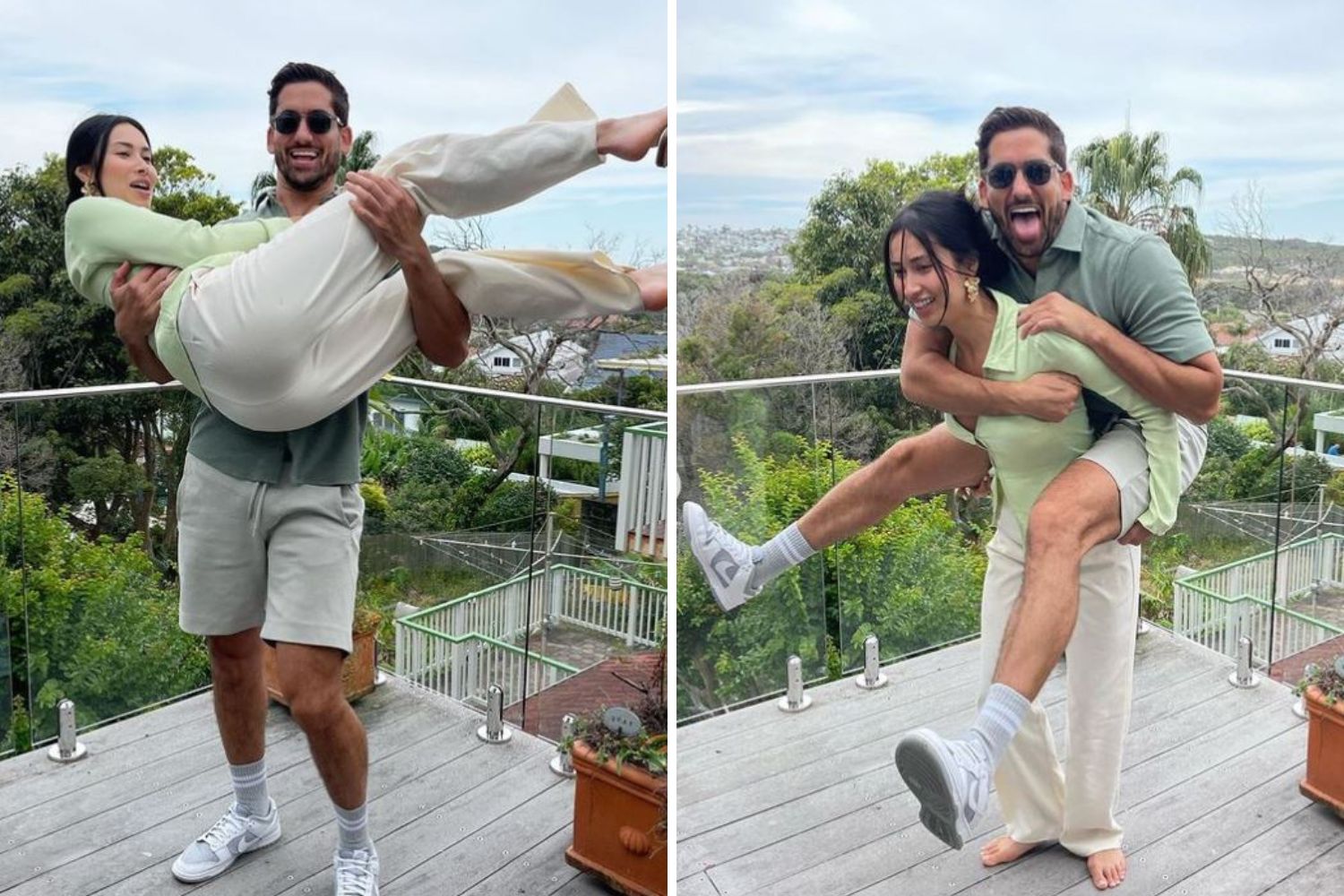 Man playfully lifts woman and gives her a piggyback ride on a balcony with a scenic view in the background.