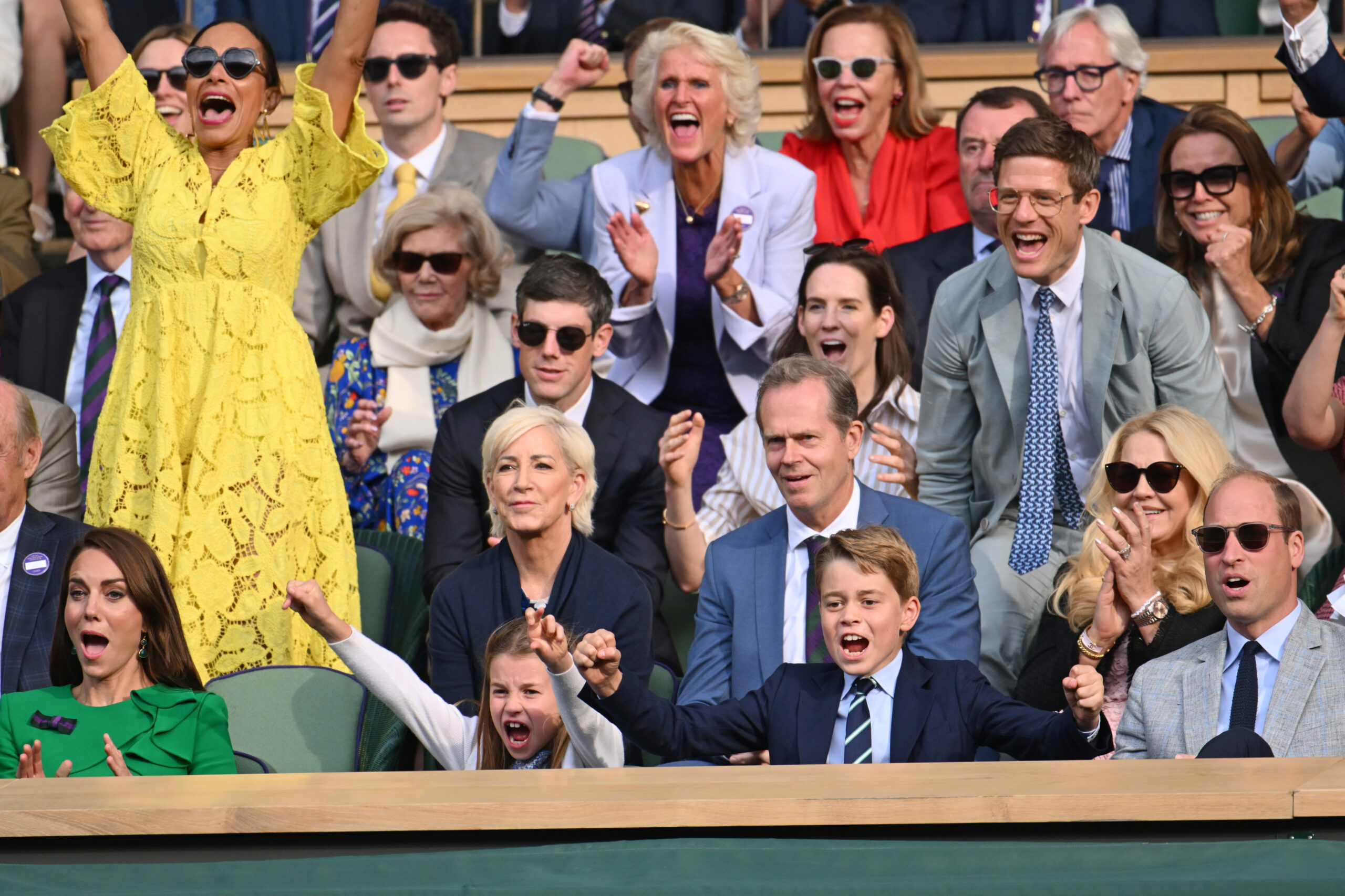 Crowd at a tennis match cheering and showing excitement, featuring people of various ages in colorful attire.