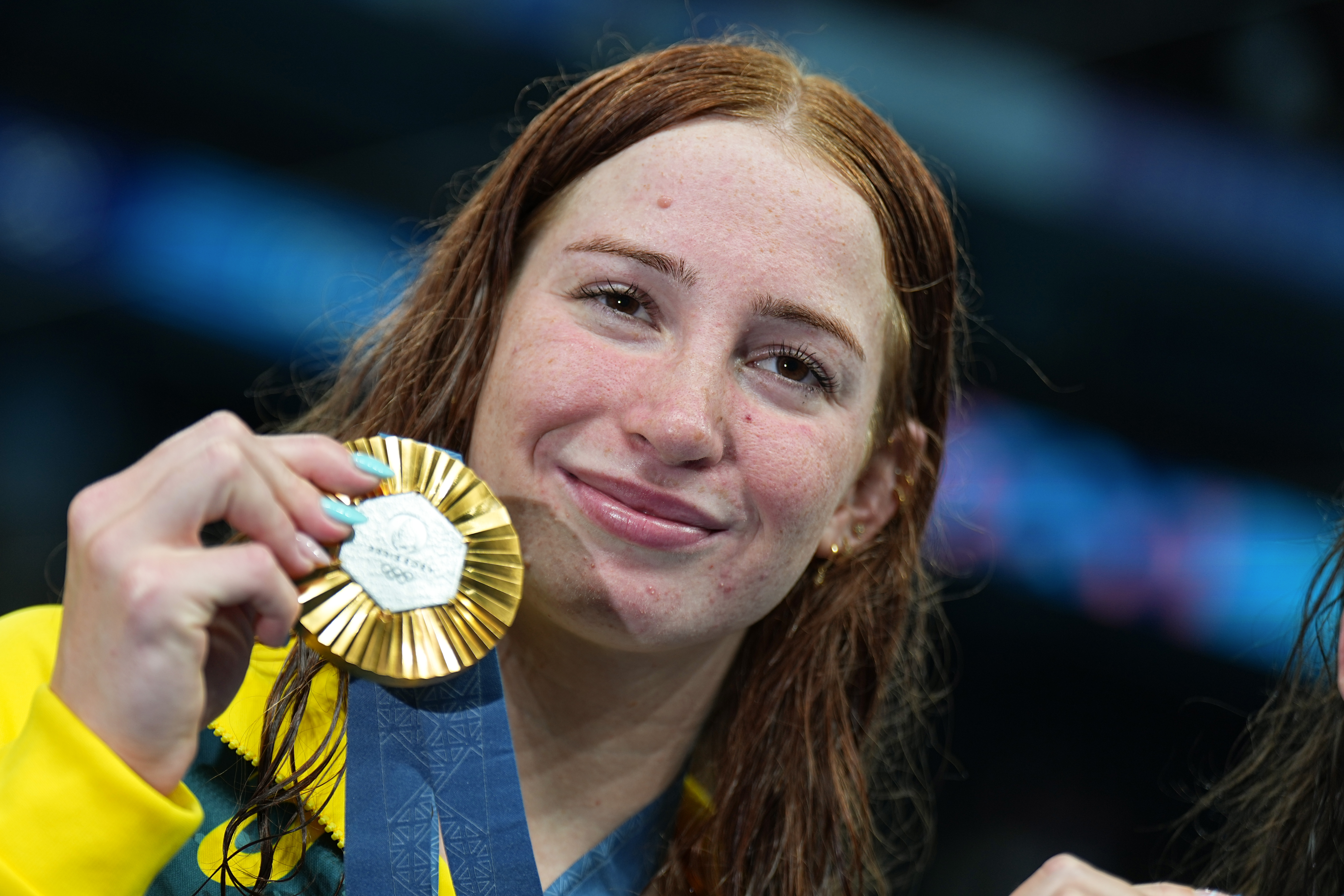 Mollie O'Callaghan from Australia celebrating with her medal.