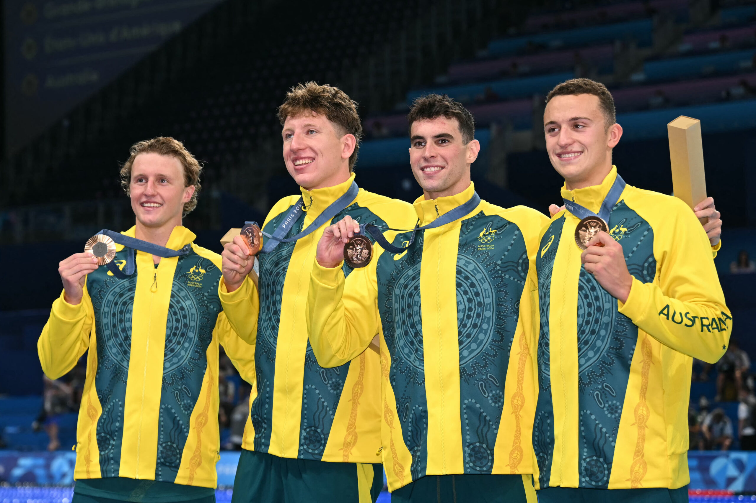Bronze medallists Australia's Maximillian Giuliani, Australia's Flynn Southam, Australia's Elijah Winnington and Australia's Thomas Neill pose following the men's 4x200m freestyle relay swimming event during the Paris 2024 Olympic Games at the Paris La Defense Arena in Nanterre, west of Paris, on July 30, 2024. (Photo by Jonathan NACKSTRAND / AFP) (Photo by JONATHAN NACKSTRAND/AFP via Getty Images)
