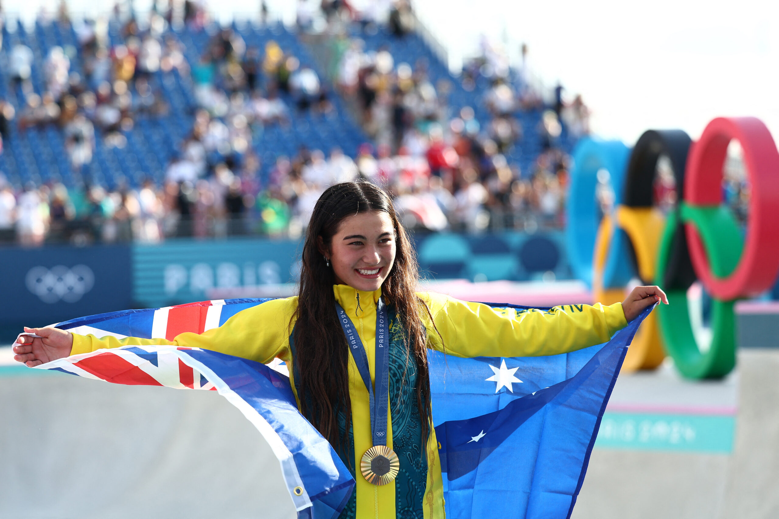 Gold medallist Australia's Arisa Trew poses during the podium ceremony for the women's park skateboarding final during the Paris 2024 Olympic Games at La Concorde in Paris on August 6, 2024. (Photo by FRANCK FIFE / AFP) (Photo by FRANCK FIFE/AFP via Getty Images)