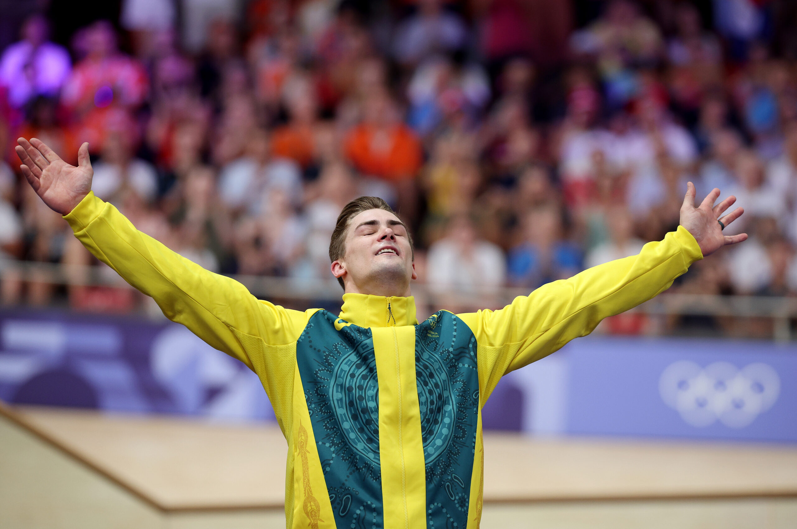 PARIS, FRANCE - AUGUST 11: Bronze medalist Matthew Glaetzer of Team Australia celebrates on the podium after the Men's Keirin, Final on day sixteen of the Olympic Games Paris 2024 at Saint-Quentin-en-Yvelines Velodrome on August 11, 2024 in Paris, France. (Photo by Jared C. Tilton/Getty Images)
