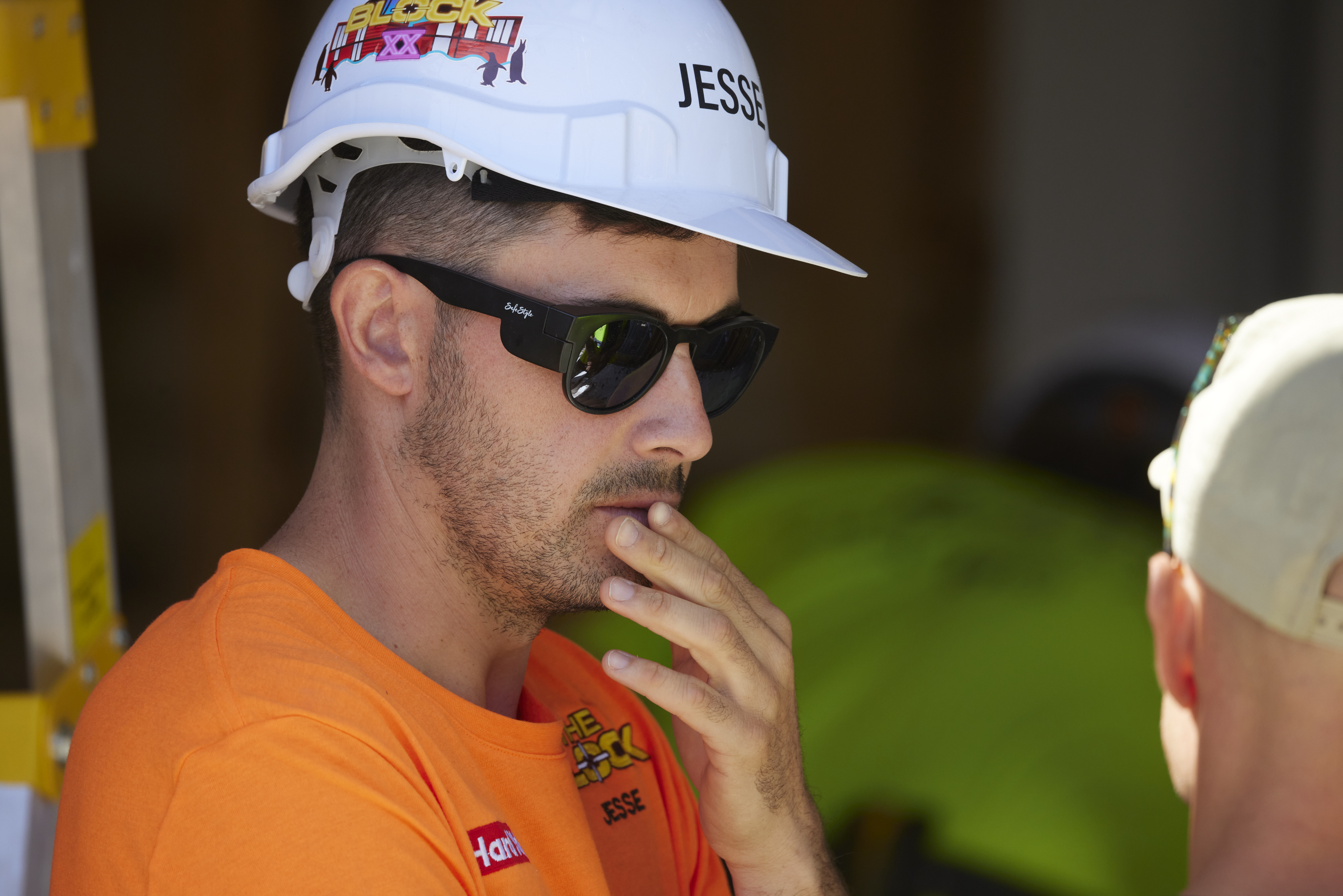the block's jesse wearing a helmet and sunglasses on set