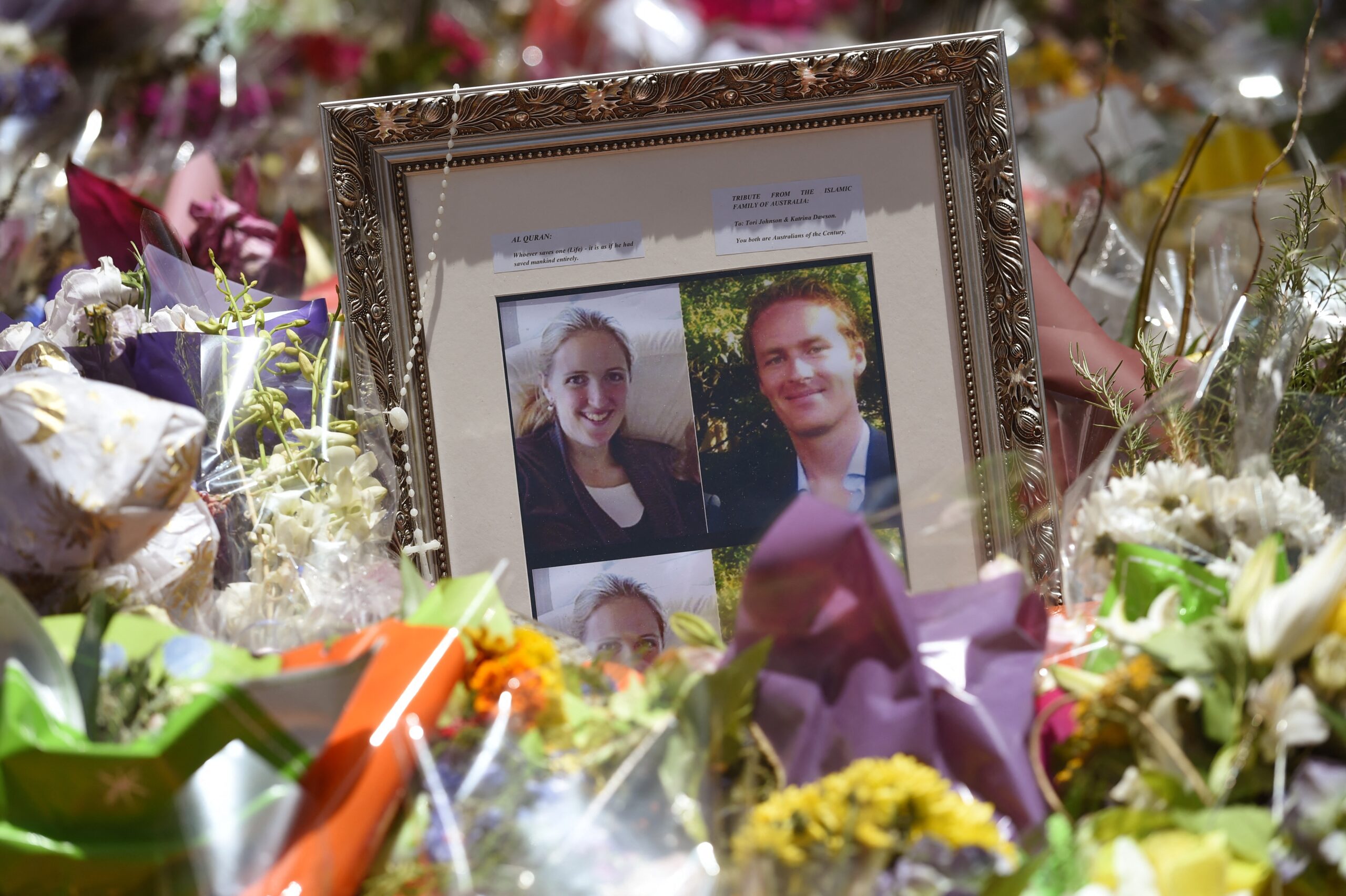 Floral tributes to Katrina Dawson and Tori Johnson were lay in Martin Place