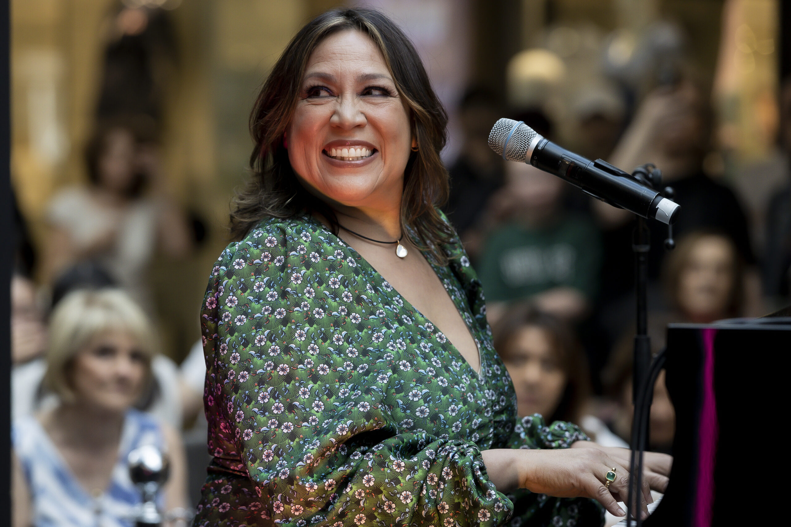 Kate Ceberano in front of a microphone