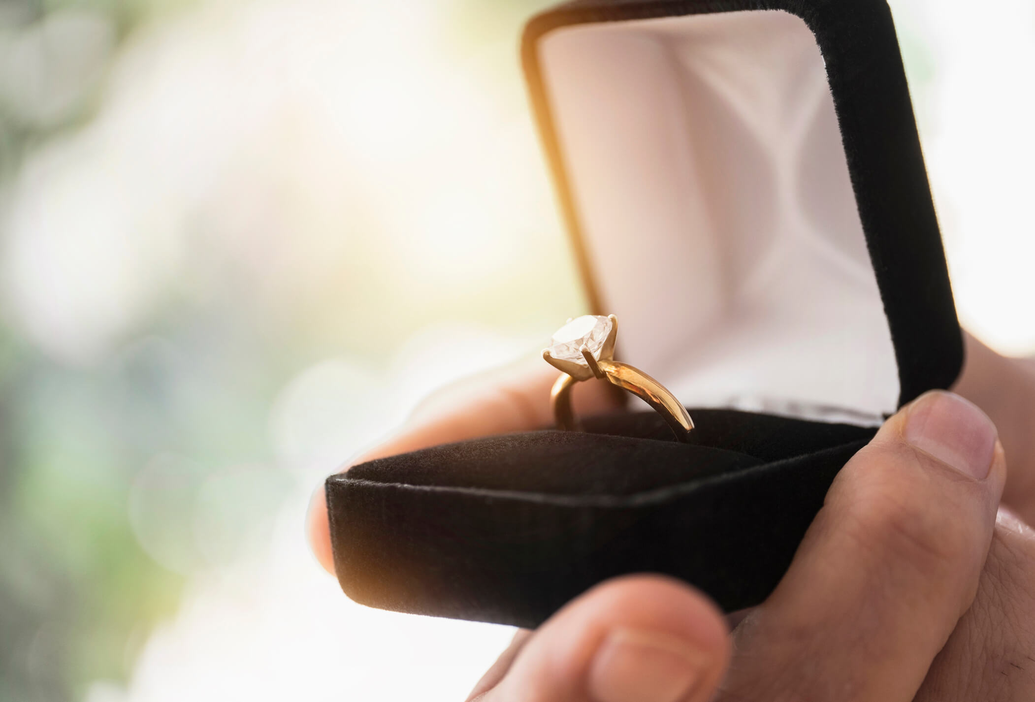 An engagement ring in a case